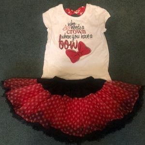 Minnie Mouse shirt and tutu skirt.